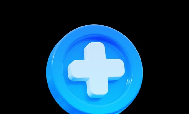 A blue circular button featuring a prominent white medical cross symbol in the center, symbolizing health or plus functionality.